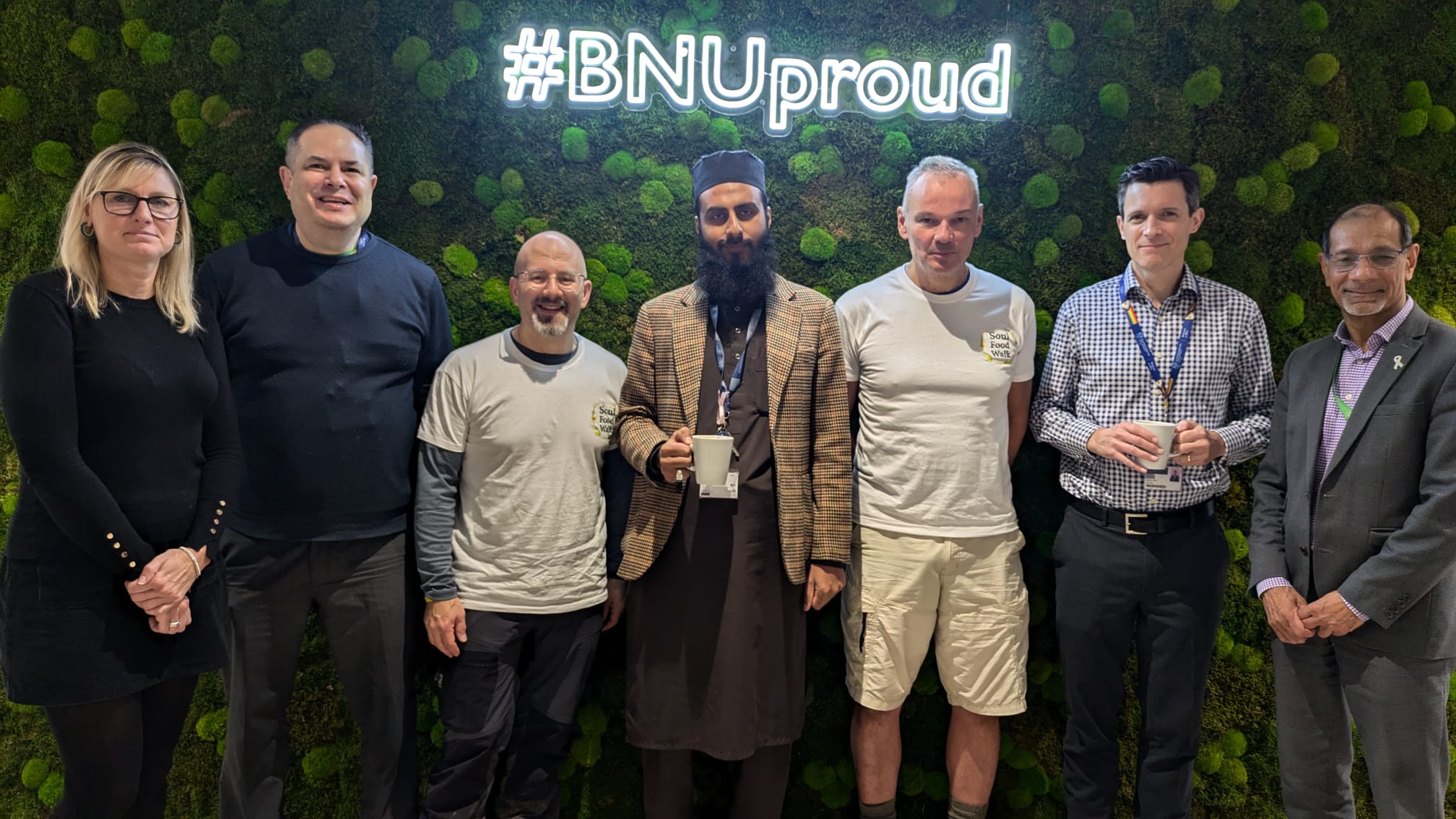 Rabbi Neil and Father Stuart with staff at a stop at Buckinghamshire New University.